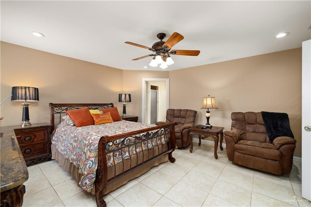 1257 Riverside Street Rio Grande City, TX 78582 - Photo 10 of 28 a bedroom with bed couch and window