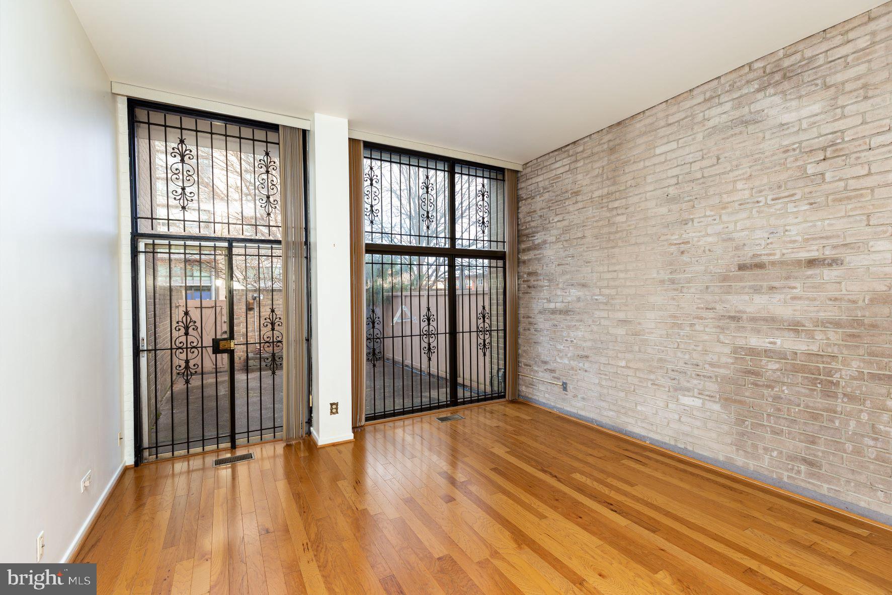 204 M Street Southwest, Unit 34 Washington, DC 20024 - Photo 11 of 28 wooden floor in an empty room with a window
