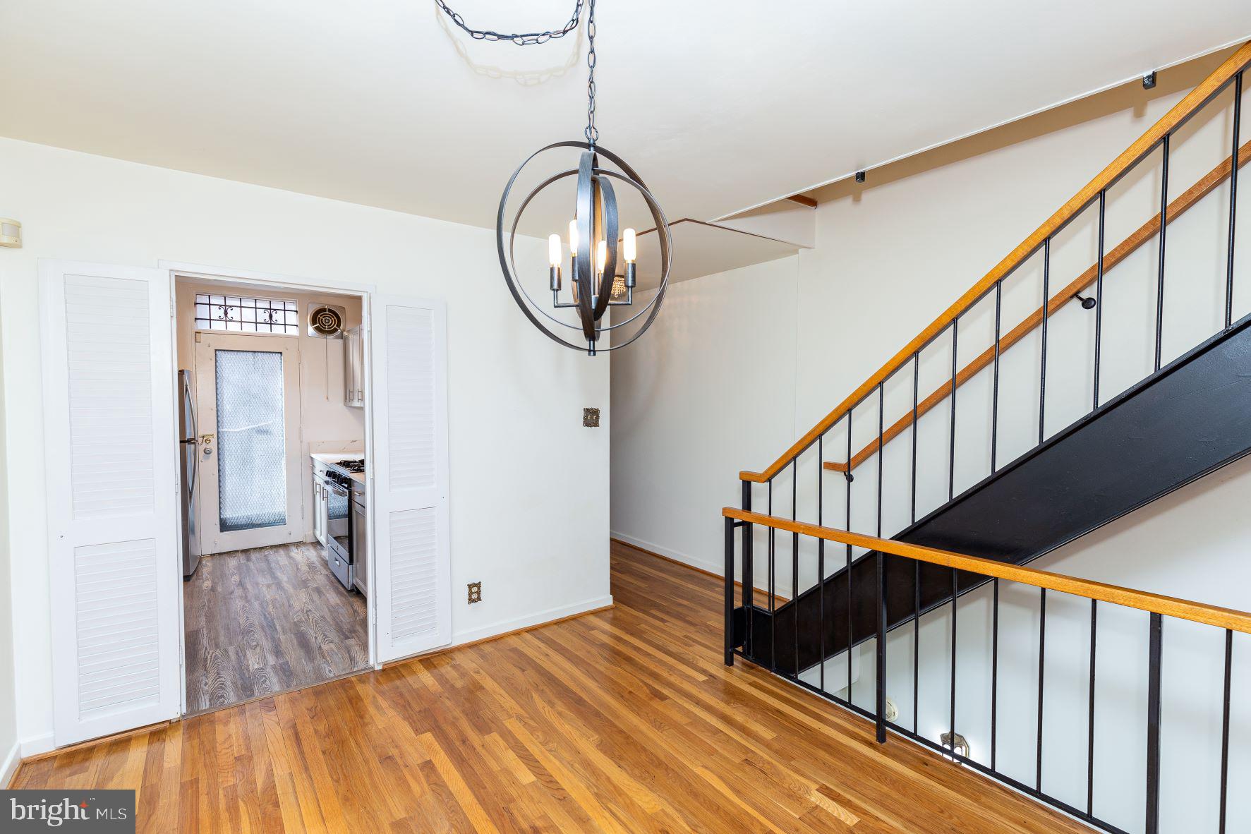204 M Street Southwest, Unit 34 Washington, DC 20024 - Photo 14 of 28 a view of a livingroom with wooden floor and stairs