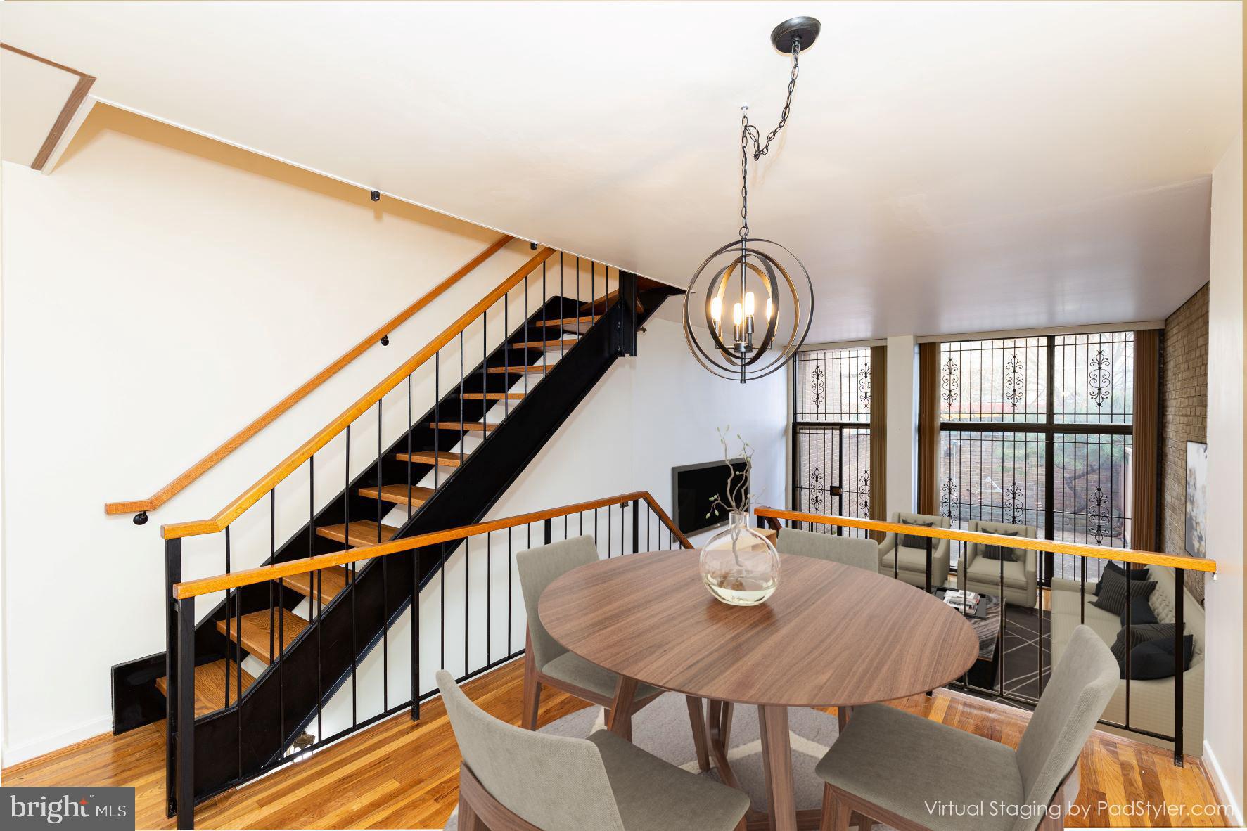 204 M Street Southwest, Unit 34 Washington, DC 20024 - Photo 2 of 28 a view of a dining room with furniture window and wooden floor