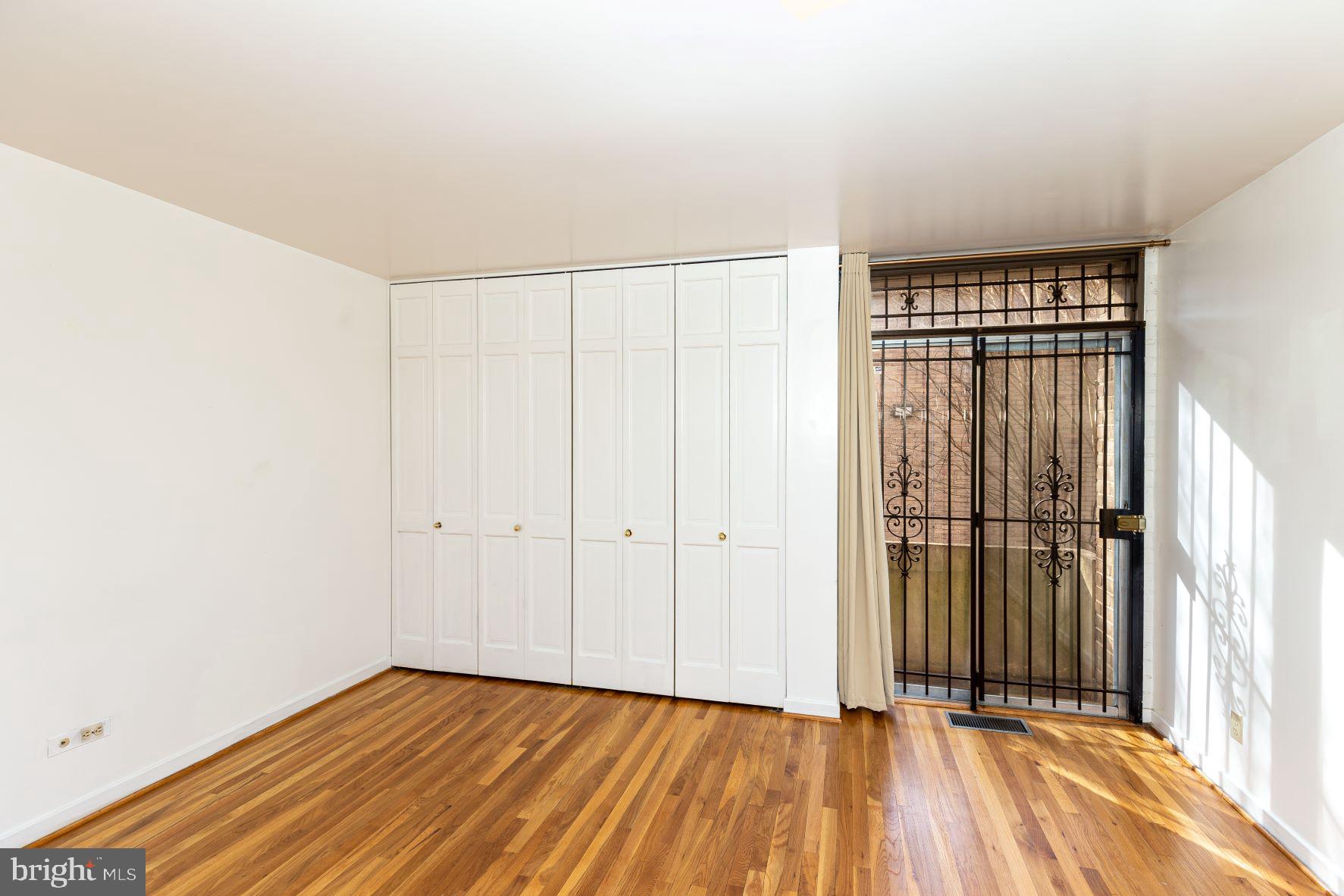 204 M Street Southwest, Unit 34 Washington, DC 20024 - Photo 22 of 28 a view of a room with wooden floor