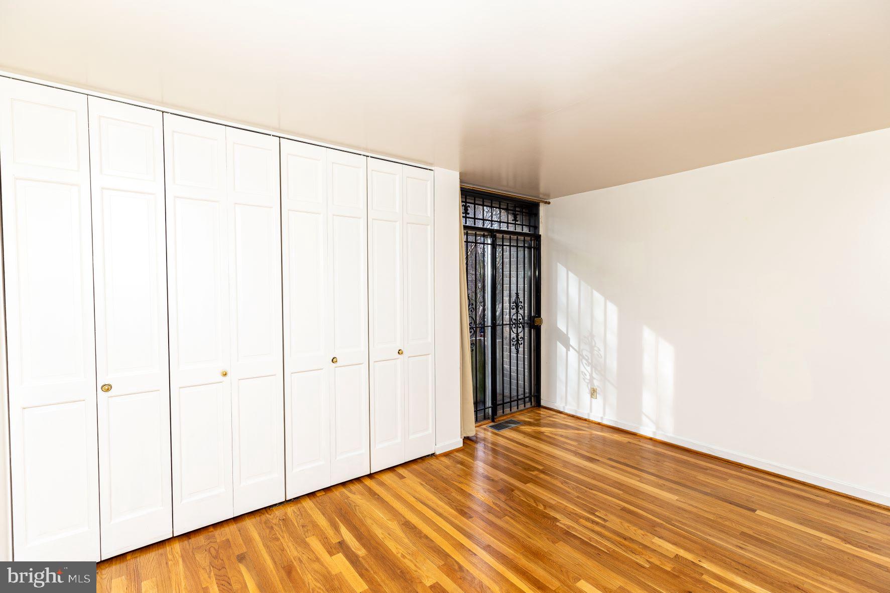 204 M Street Southwest, Unit 34 Washington, DC 20024 - Photo 24 of 28 a view of a room with wooden floor