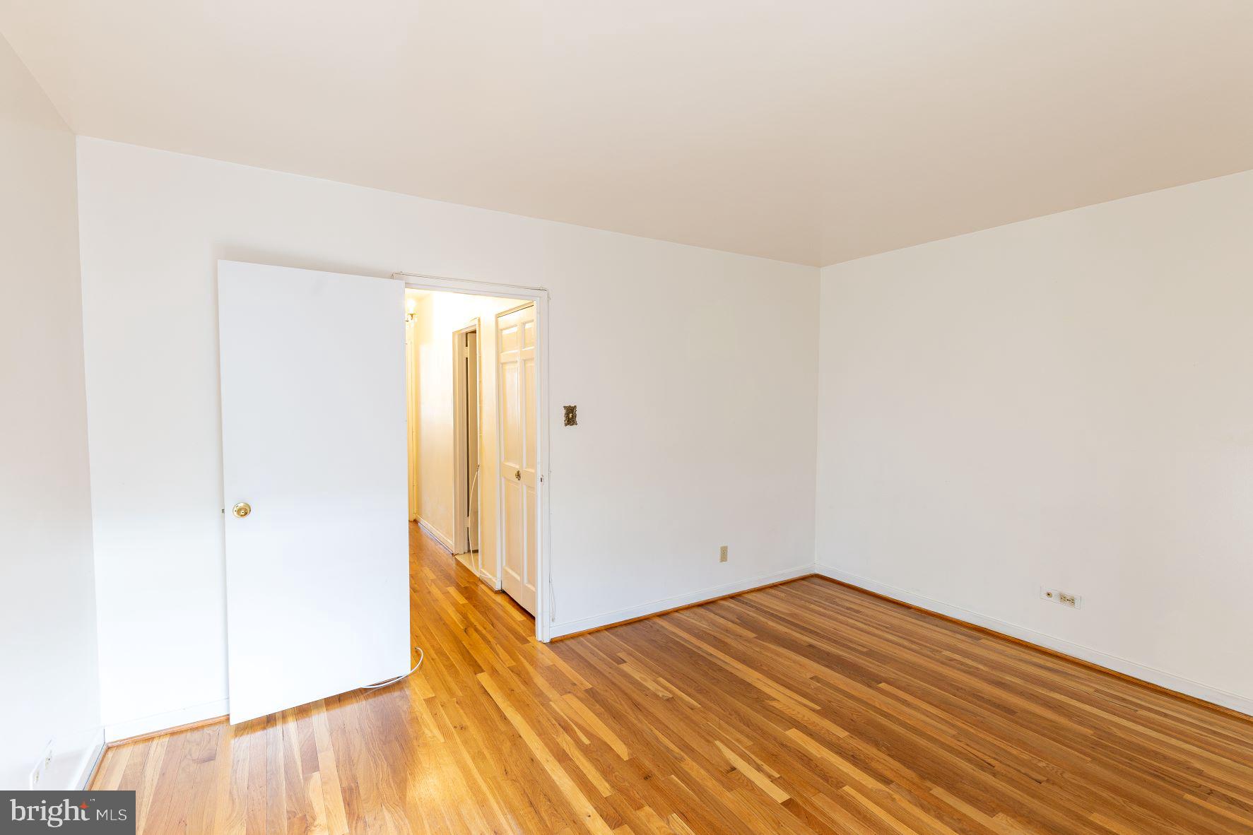 204 M Street Southwest, Unit 34 Washington, DC 20024 - Photo 25 of 28 a view of empty room with wooden floor