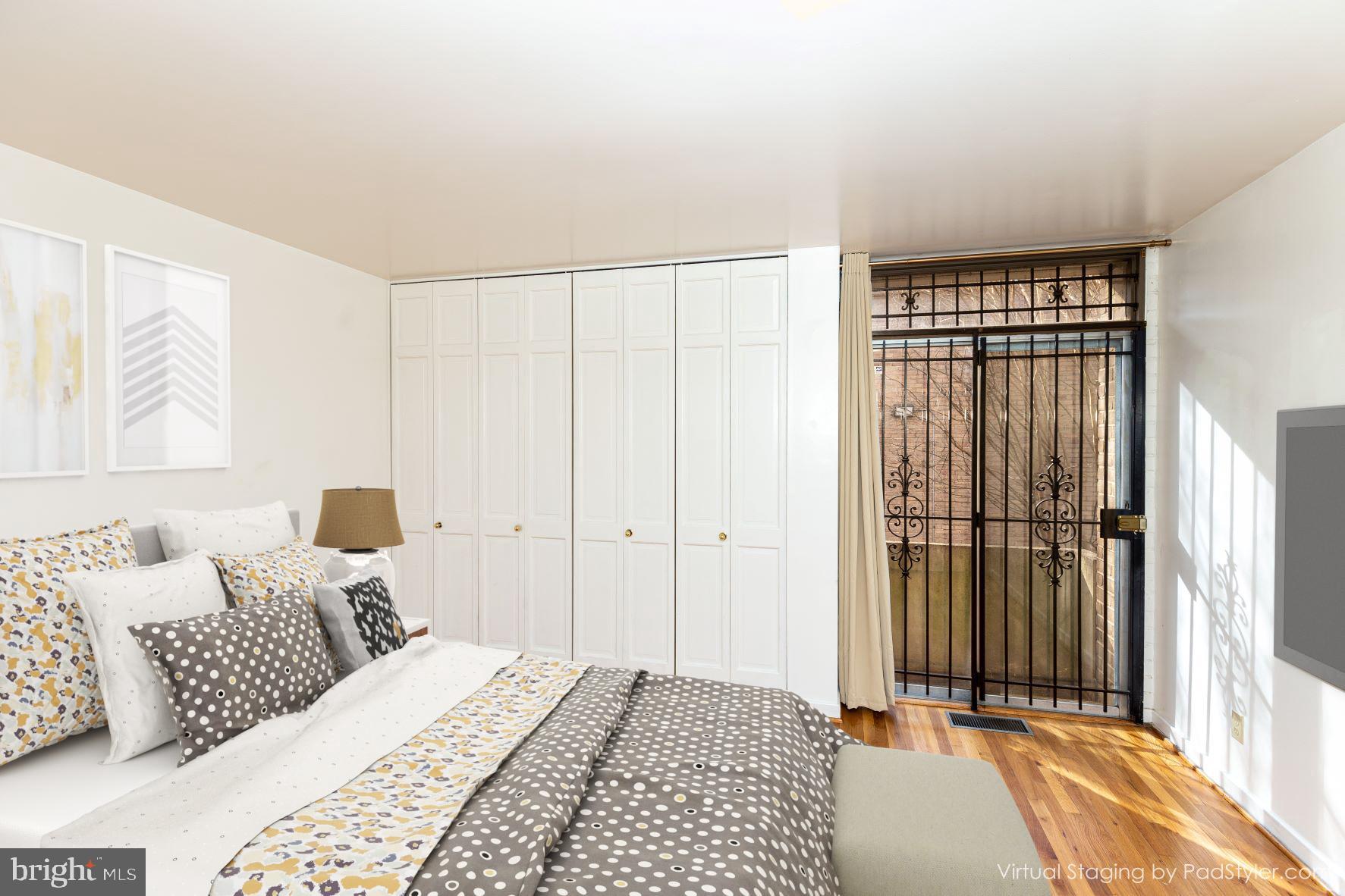 204 M Street Southwest, Unit 34 Washington, DC 20024 - Photo 4 of 28 a bedroom with a bed and a window