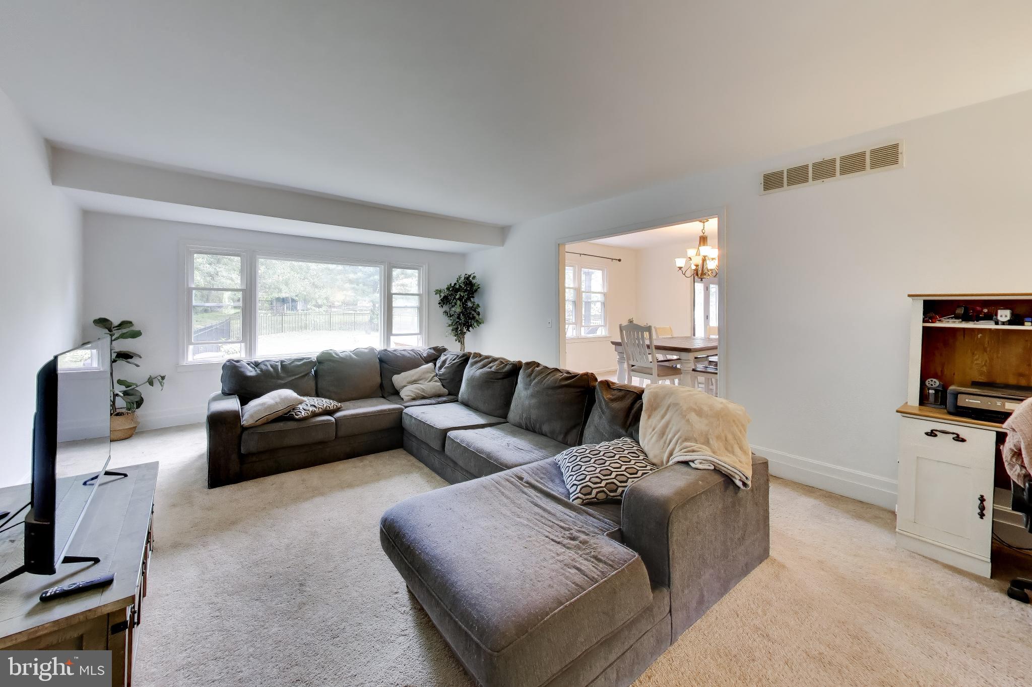 3240 Juniper Lane Huntingtown, MD 20639 - Photo 4 of 48 a living room with furniture and a flat screen tv