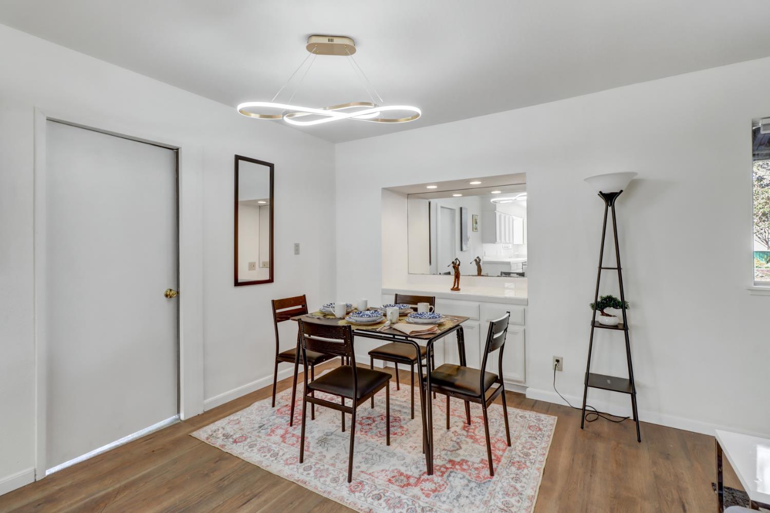 10556 Olson Drive Rancho Cordova, CA 95670 - Photo 12 of 46 a view of a dining room with furniture and wooden floor