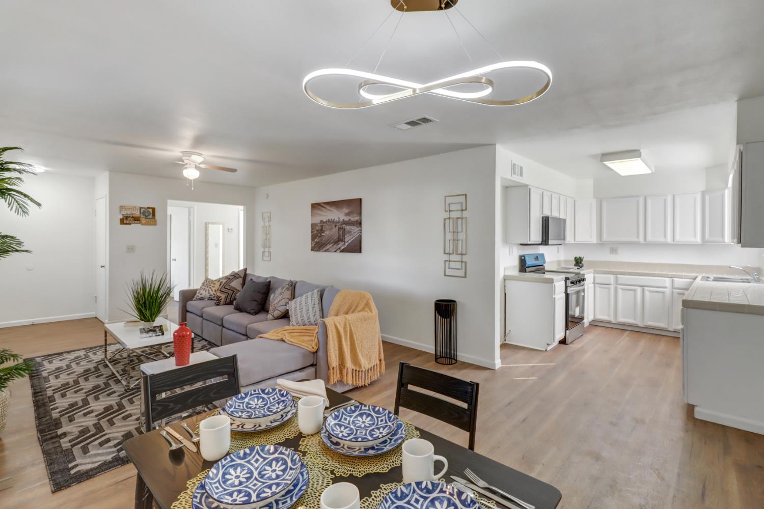 10556 Olson Drive Rancho Cordova, CA 95670 - Photo 13 of 46 a living room with furniture and kitchen view