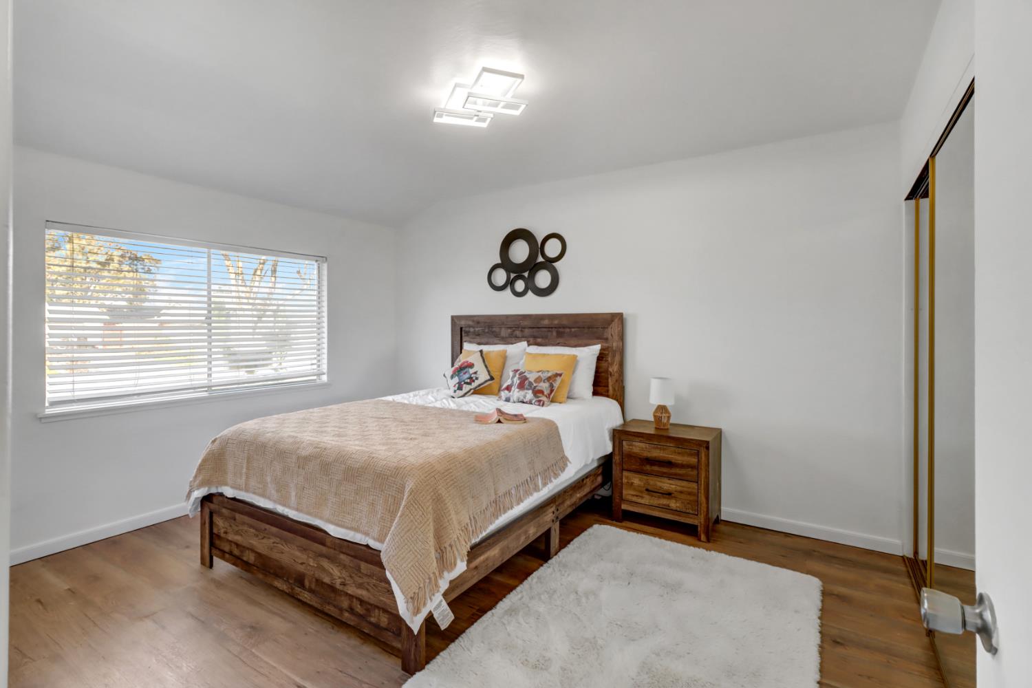 10556 Olson Drive Rancho Cordova, CA 95670 - Photo 23 of 46 a bed sitting in a bedroom next to a window