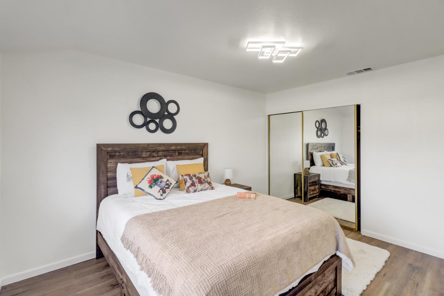 10556 Olson Drive Rancho Cordova, CA 95670 - Photo 24 of 46 a bedroom with a bed and a chandelier