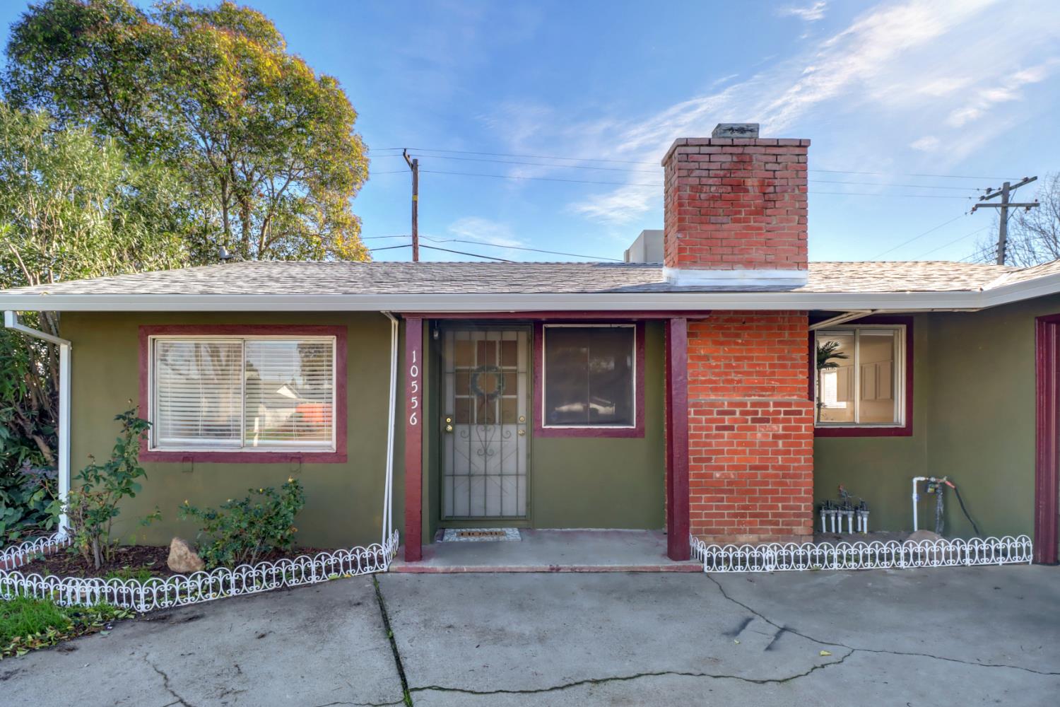 10556 Olson Drive Rancho Cordova, CA 95670 - Photo 3 of 46 a front view of a house with a tree