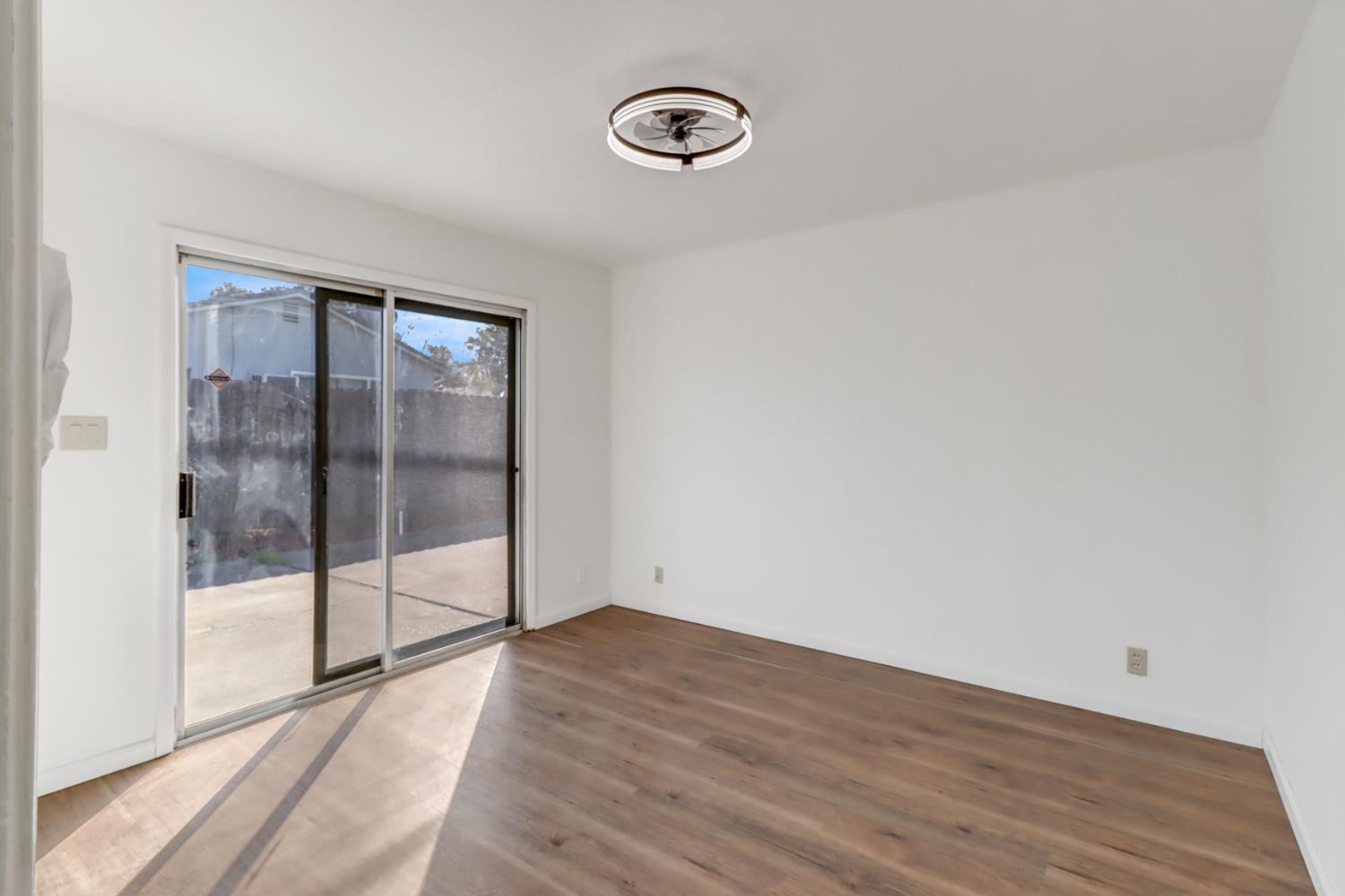10556 Olson Drive Rancho Cordova, CA 95670 - Photo 31 of 46 a view of empty room with wooden floor