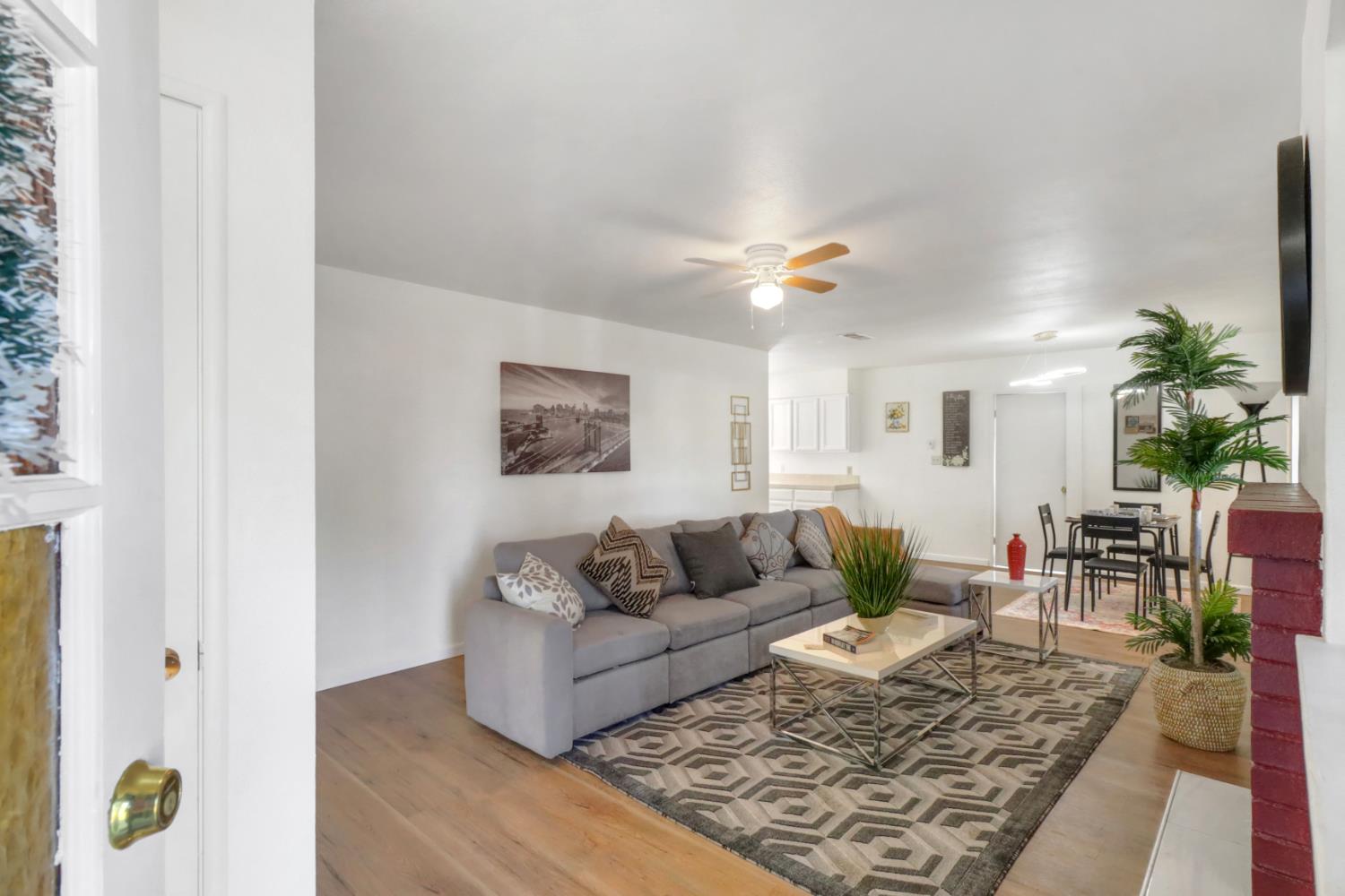10556 Olson Drive Rancho Cordova, CA 95670 - Photo 5 of 46 a living room with furniture and wooden floor