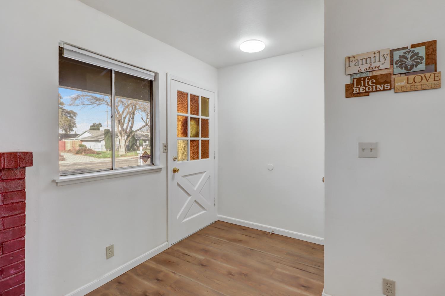 10556 Olson Drive Rancho Cordova, CA 95670 - Photo 6 of 46 a view of an entryway with wooden floor