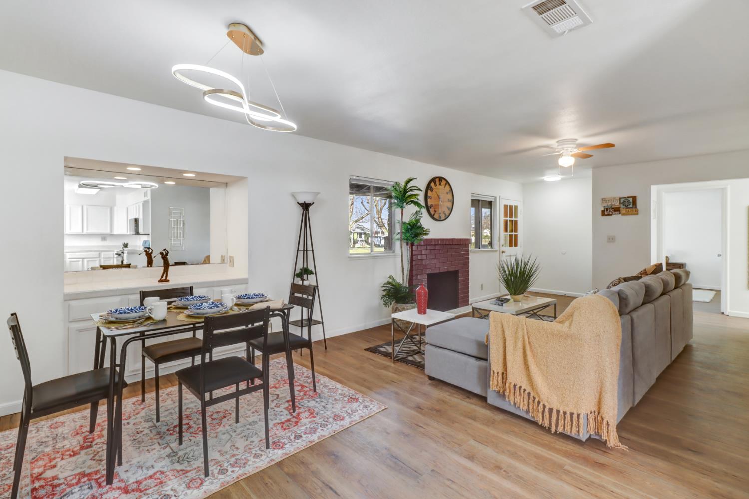 10556 Olson Drive Rancho Cordova, CA 95670 - Photo 7 of 46 a living room with fireplace furniture and a wooden floor