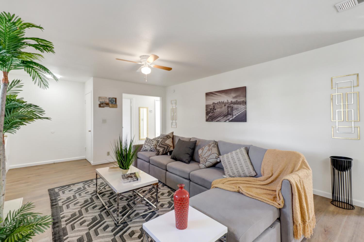 10556 Olson Drive Rancho Cordova, CA 95670 - Photo 9 of 46 a living room with furniture and wooden floor