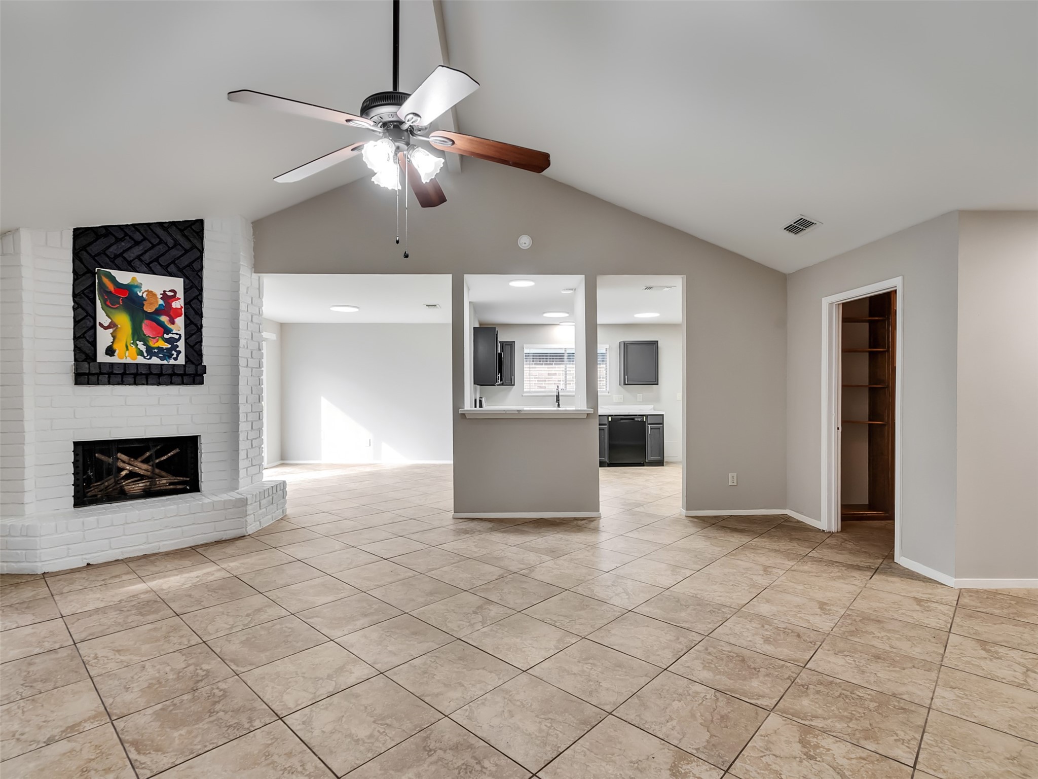 2627 North Spring Drive Spring, TX 77373 - Photo 2 of 14 Den with fireplace looking into kitchen