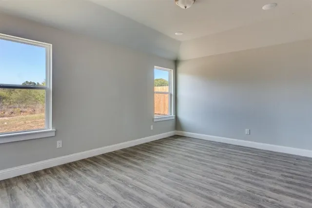 a view of kitchen with sink and wooden floor