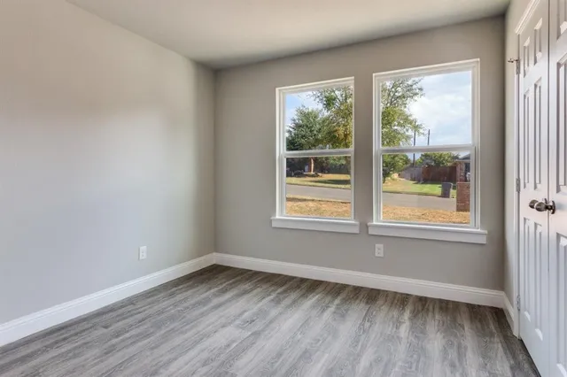 a bathroom with a granite countertop sink and a bathtub