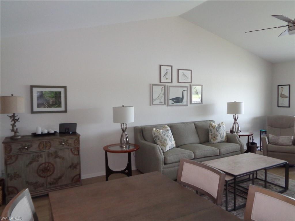 6250 Bellerive Avenue, Unit 5 Naples, FL 34119 - Photo 14 of 37 a living room with furniture