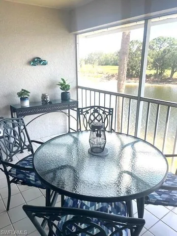 a view of a dining room with furniture window and outside view