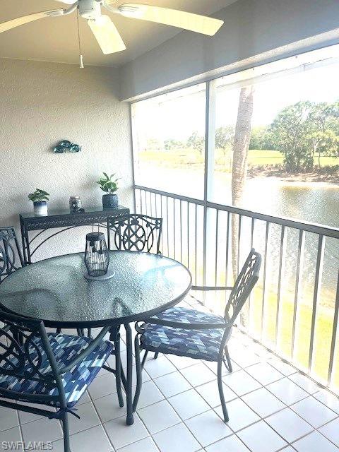 6250 Bellerive Avenue, Unit 5 Naples, FL 34119 - Photo 16 of 37 a view of a dining room with furniture window and wooden floor