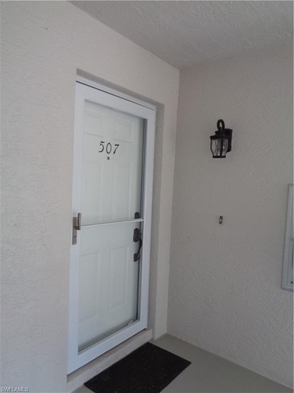 6250 Bellerive Avenue, Unit 5 Naples, FL 34119 - Photo 2 of 37 a view of a hallway