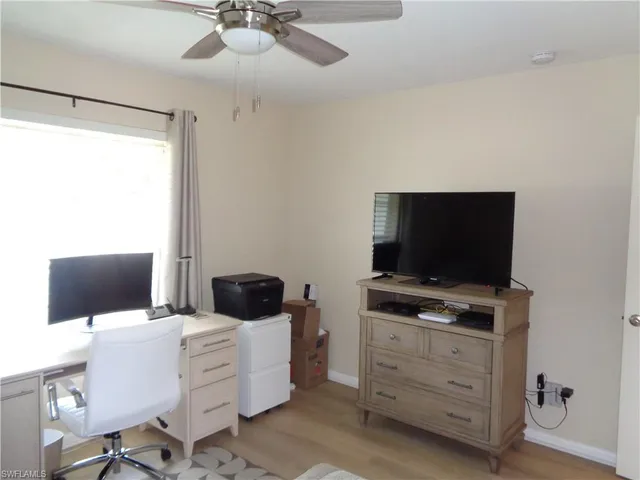 a room with furniture and flat screen tv