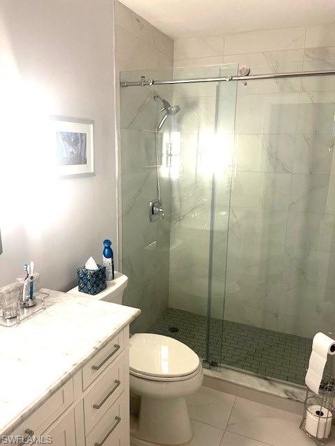 6250 Bellerive Avenue, Unit 5 Naples, FL 34119 - Photo 28 of 37 a bathroom with a sink toilet and shower