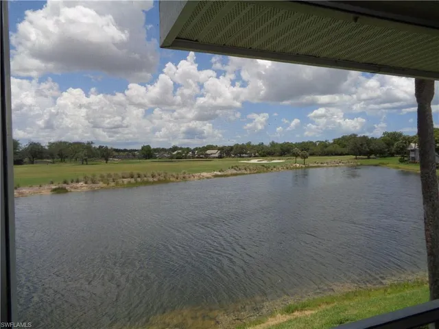a view of a lake with a big yard