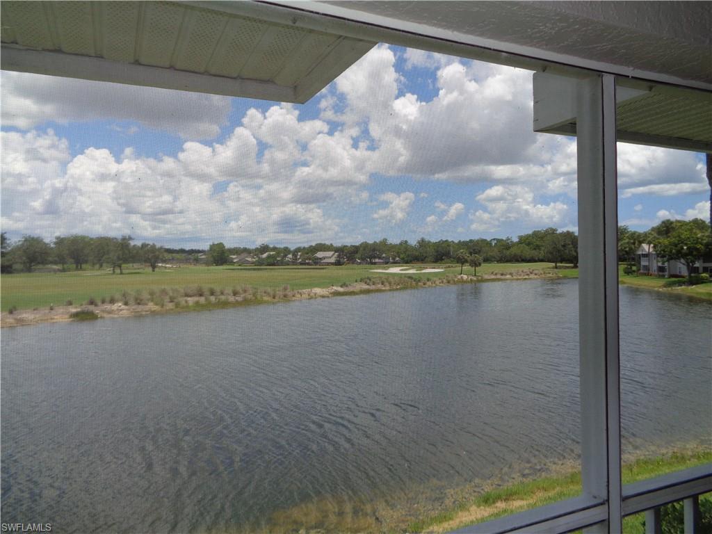 6250 Bellerive Avenue, Unit 5 Naples, FL 34119 - Photo 36 of 37 a view of a lake from a balcony