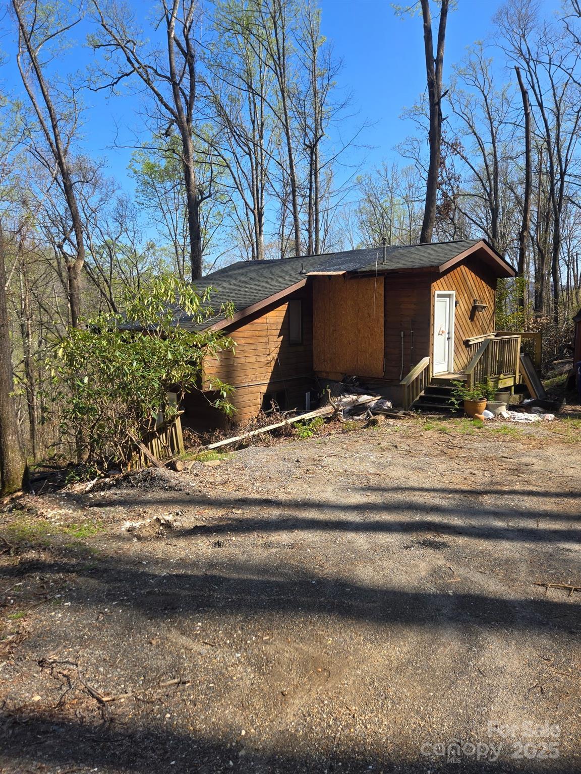 a view of a house with a yard covered with snow