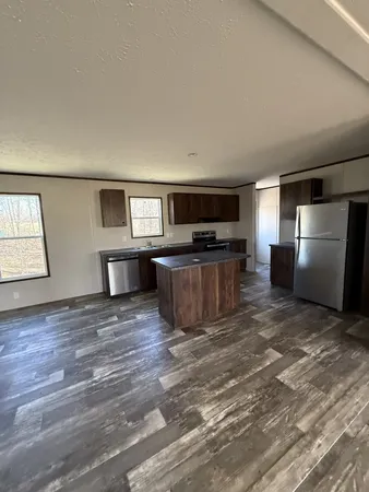 a view of kitchen with furniture and wooden floor
