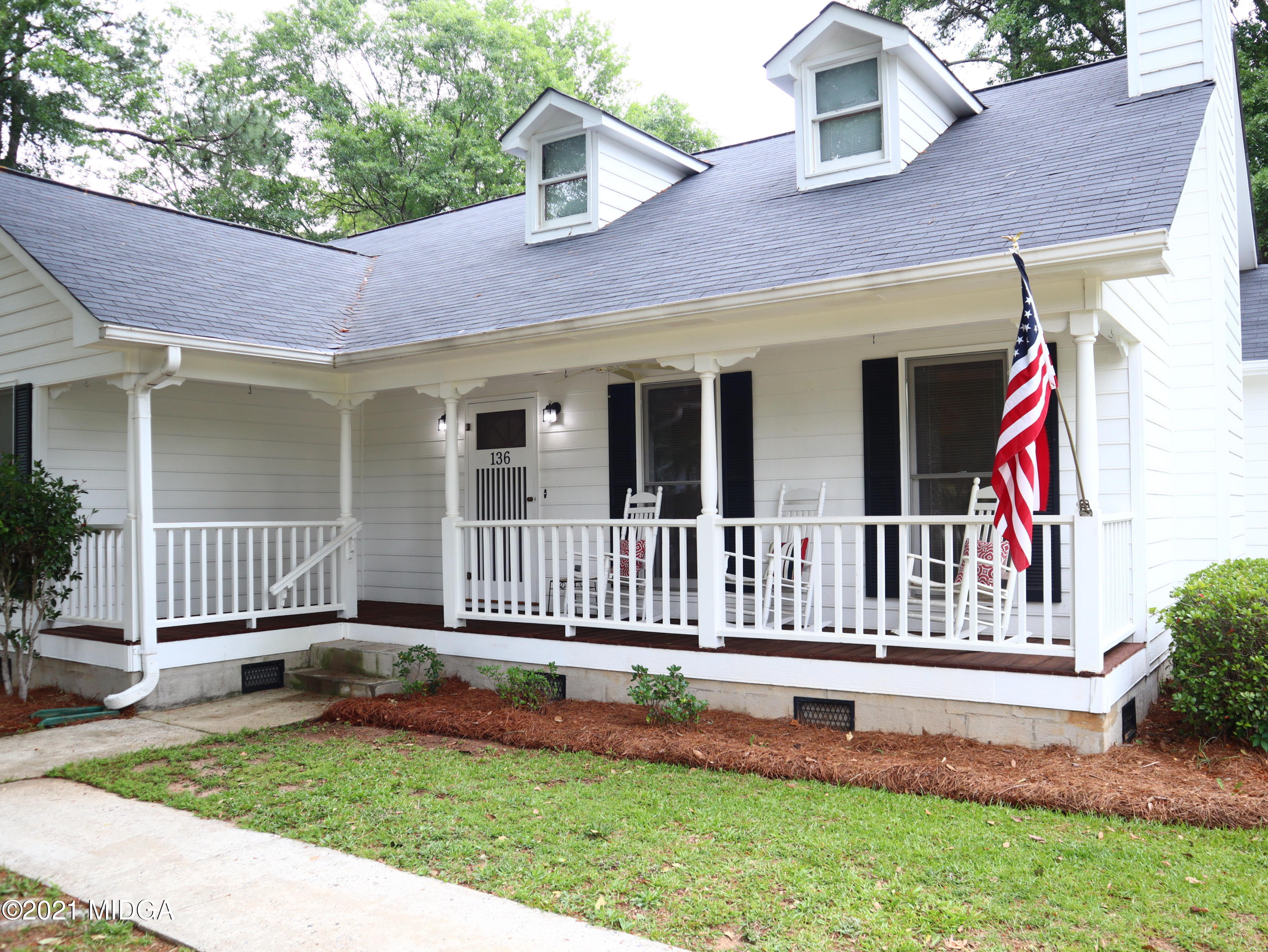 a house view with a garden space