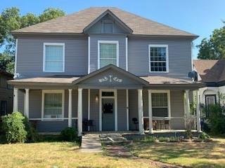 617 West Gandy Street, Unit 3 Denison, TX 75020 - Photo 1 of 14 a front view of a house with garden and porch