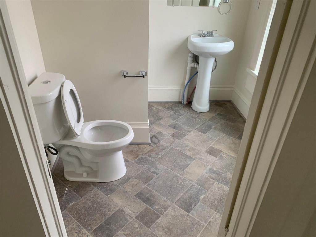 617 West Gandy Street, Unit 3 Denison, TX 75020 - Photo 13 of 14 a bathroom with a sink toilet and shower