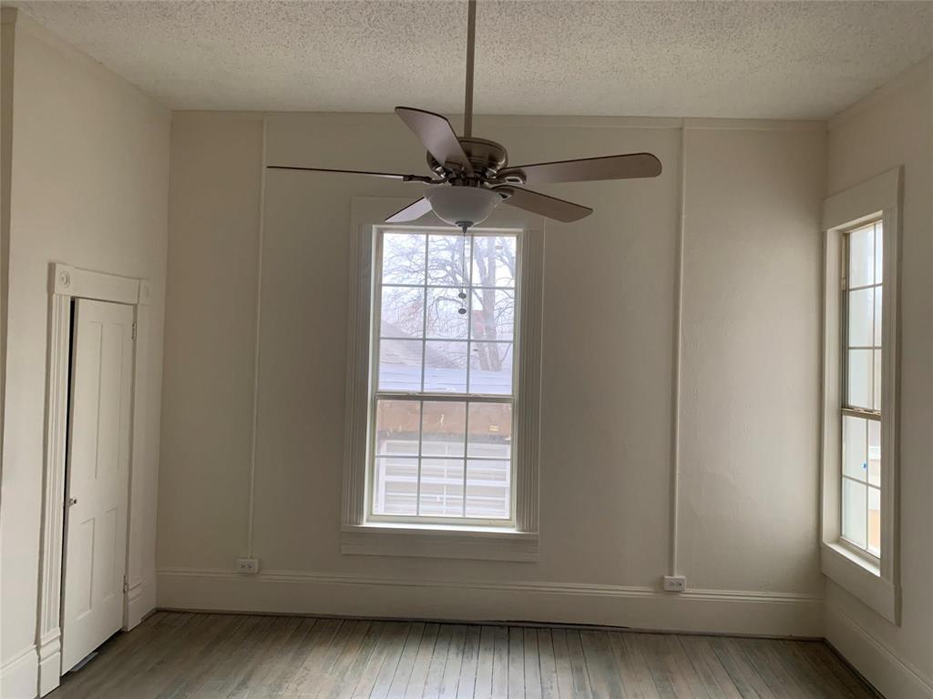 617 West Gandy Street, Unit 3 Denison, TX 75020 - Photo 5 of 14 a view of an empty room with a window