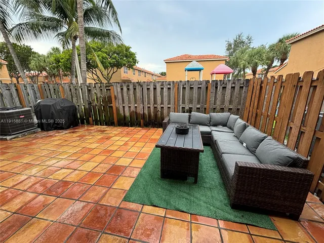 a view of a backyard with a patio