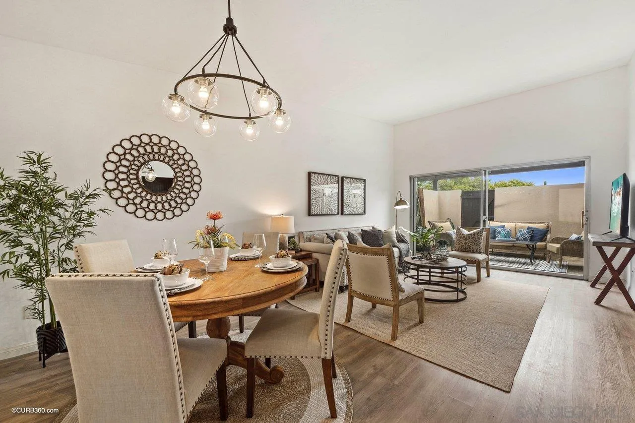 12218 Rancho Bernardo Road, Unit B San Diego, CA 92128 - Photo 14 of 30 a view of a dining room with furniture and chandelier