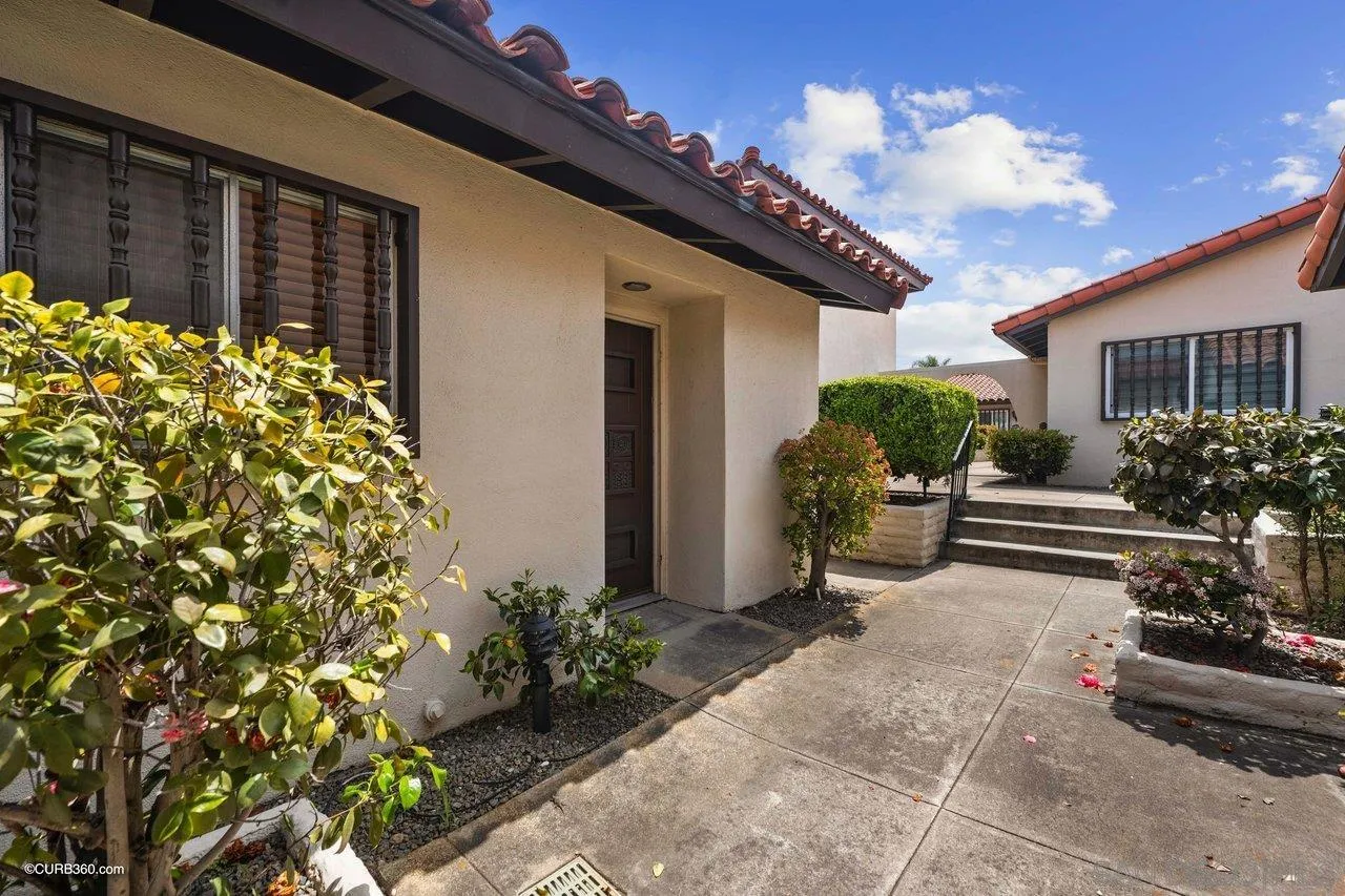 12218 Rancho Bernardo Road, Unit B San Diego, CA 92128 - Photo 3 of 30 a view of a house with a flower garden