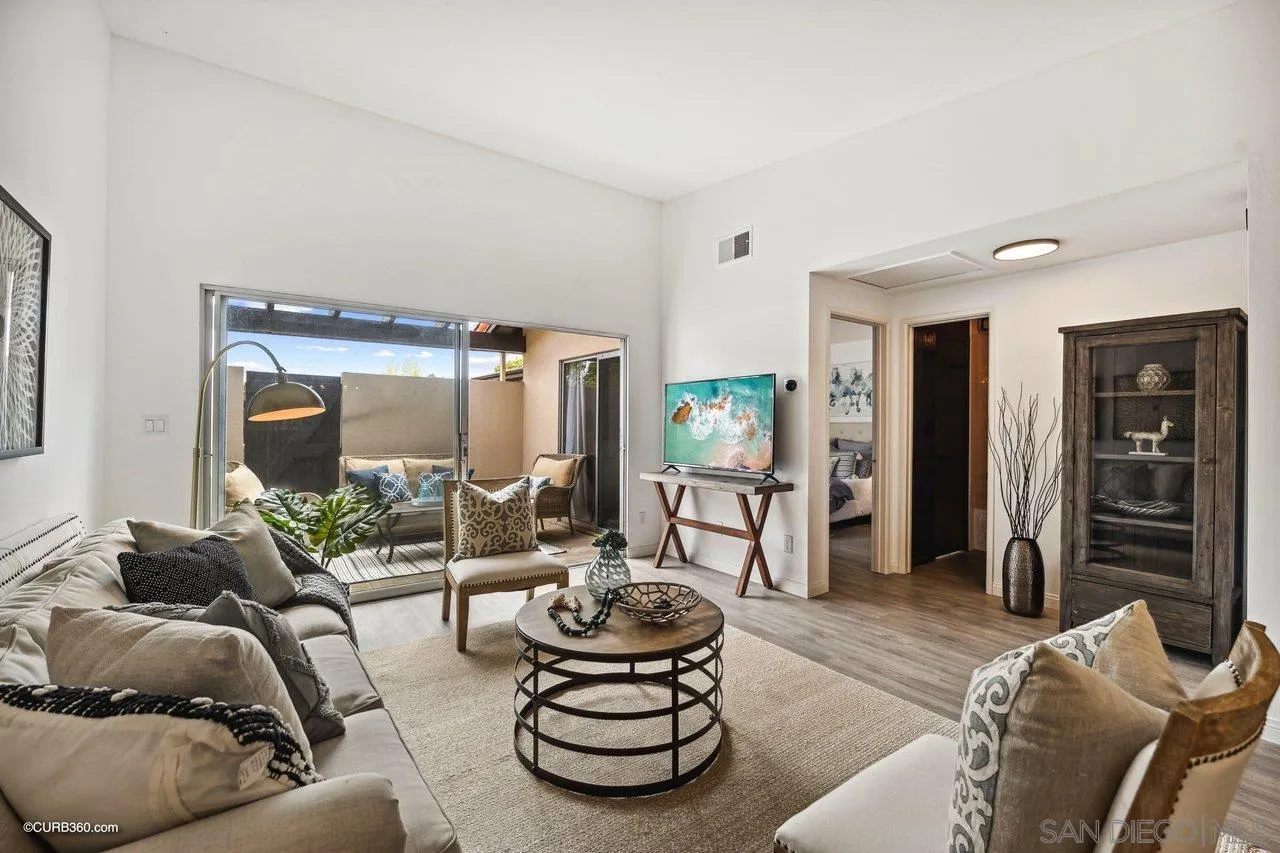 12218 Rancho Bernardo Road, Unit B San Diego, CA 92128 - Photo 5 of 30 a living room with furniture and a large window