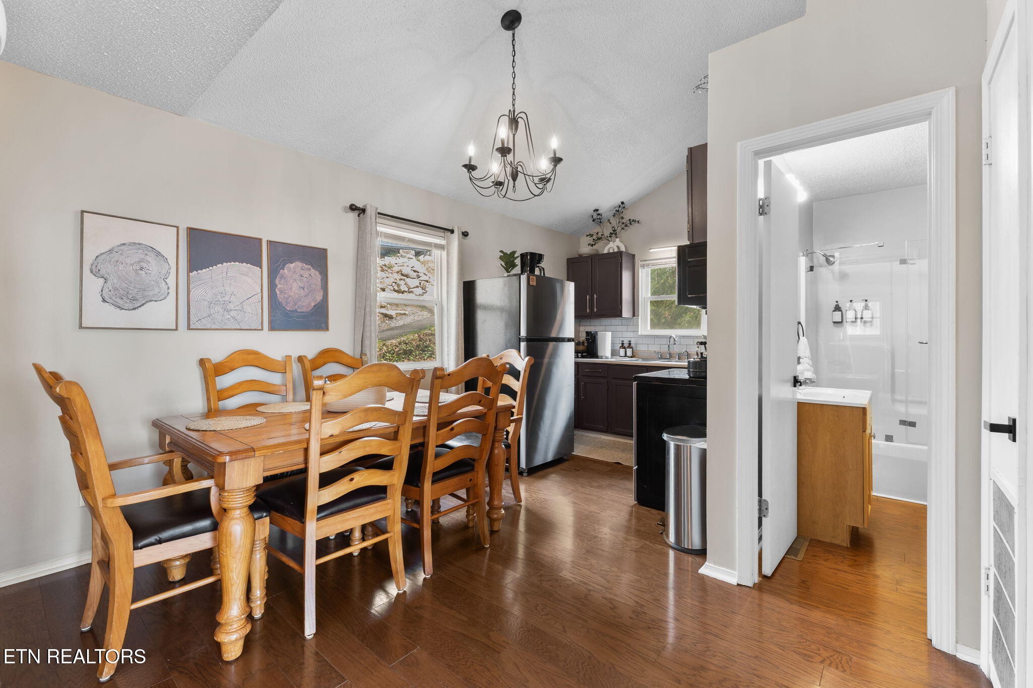 1115 Red Maple Lane Sevierville, TN 37876 - Photo 23 of 55 a view of a dining room with furniture and wooden floor