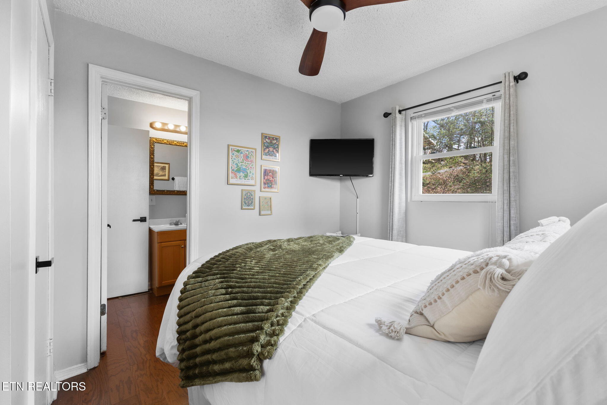 1115 Red Maple Lane Sevierville, TN 37876 - Photo 31 of 55 a bedroom with a bed and a television