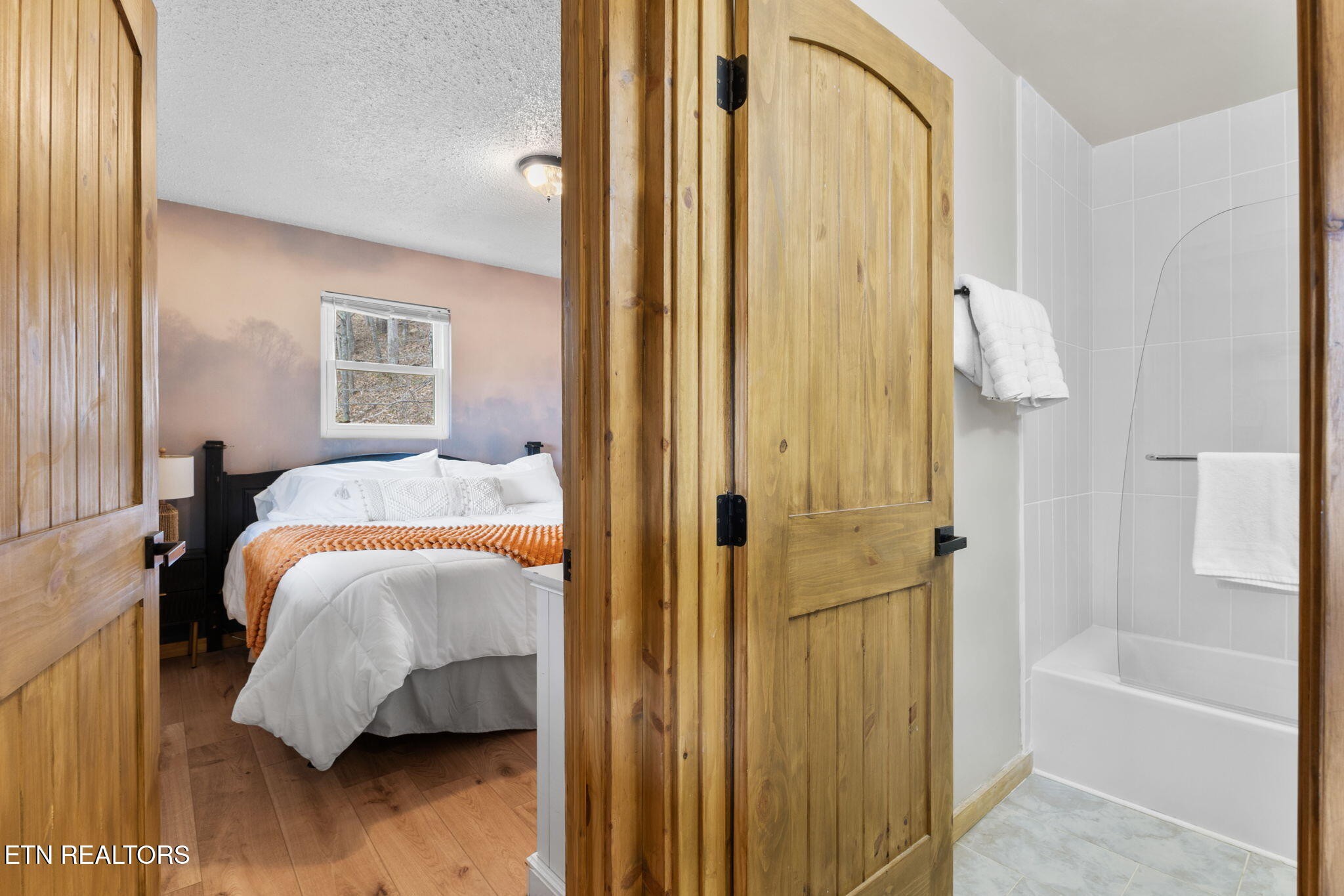 1115 Red Maple Lane Sevierville, TN 37876 - Photo 37 of 55 a bedroom with a bed and a walk in closet