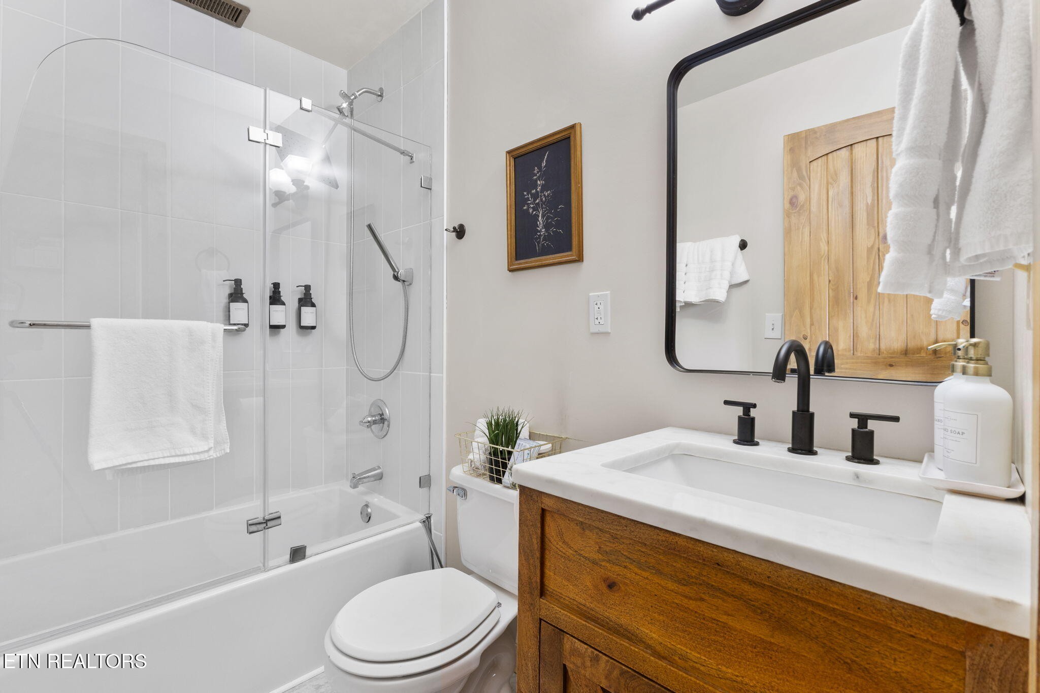 1115 Red Maple Lane Sevierville, TN 37876 - Photo 38 of 55 a bathroom with a granite countertop sink toilet tub and shower
