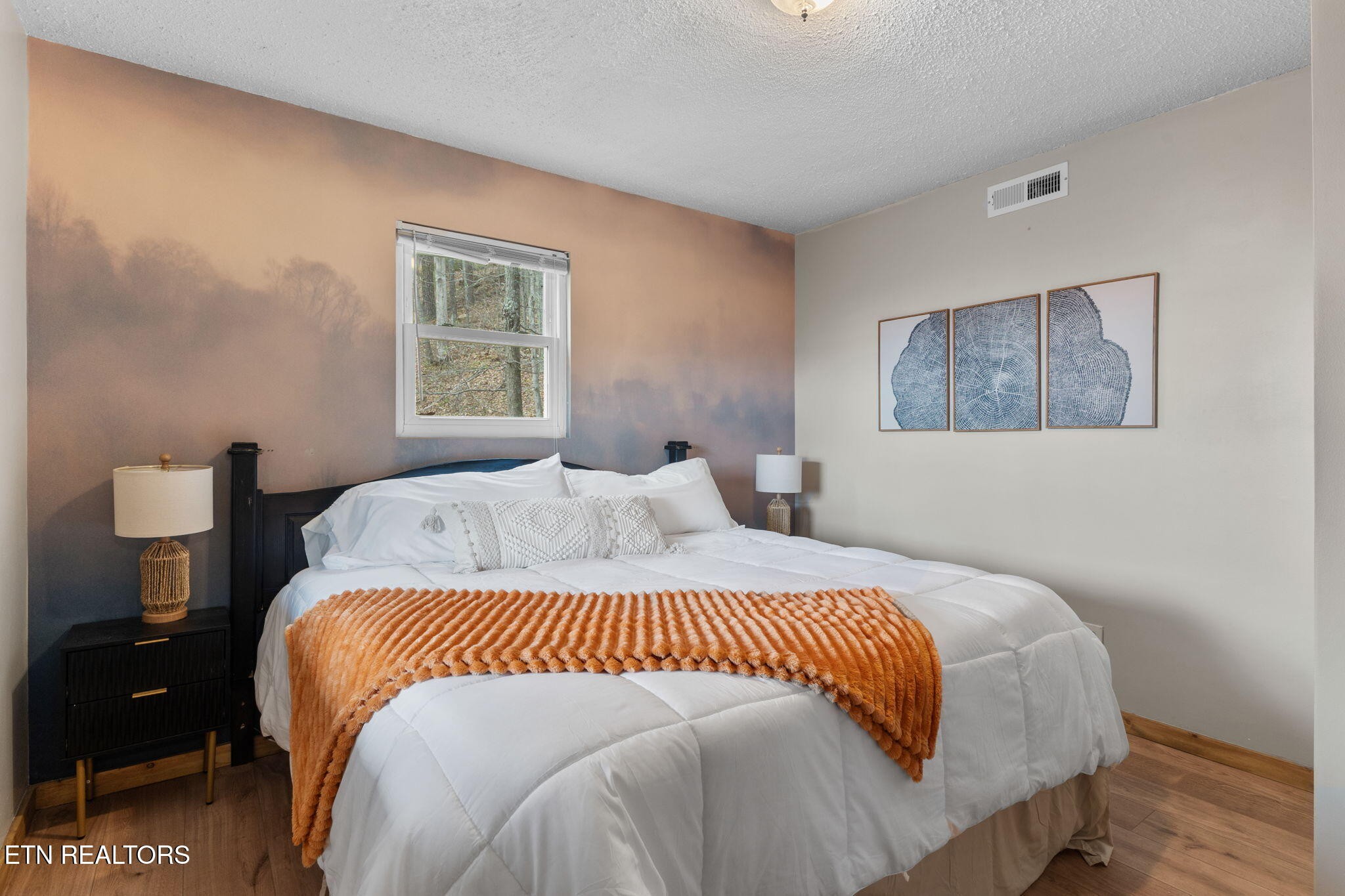 1115 Red Maple Lane Sevierville, TN 37876 - Photo 39 of 55 a bedroom with a bed and wooden floor