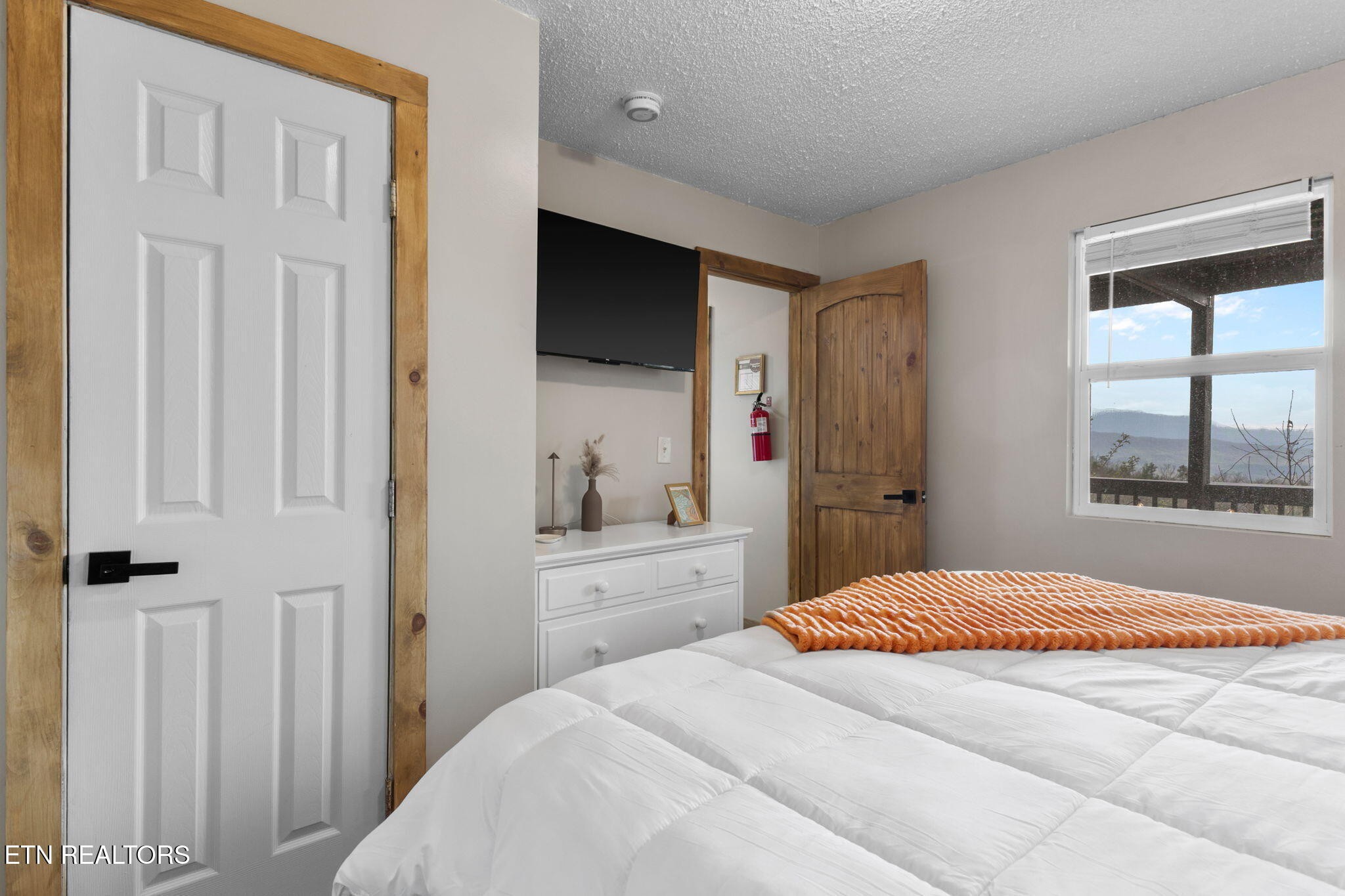 1115 Red Maple Lane Sevierville, TN 37876 - Photo 41 of 55 a bedroom with a bed and a window