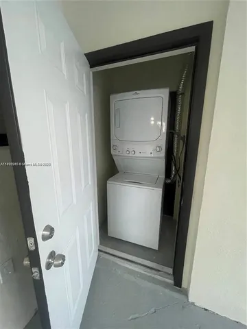 a utility room with washing machine