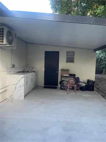 a view of a livingroom with furniture and storage