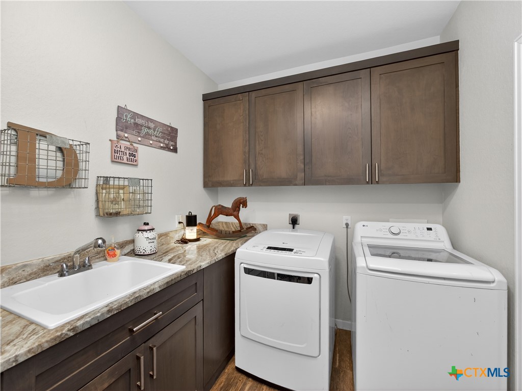 494 Flash Circle Luling, TX 78648 - Photo 29 of 44 a utility room with sink dryer and washer