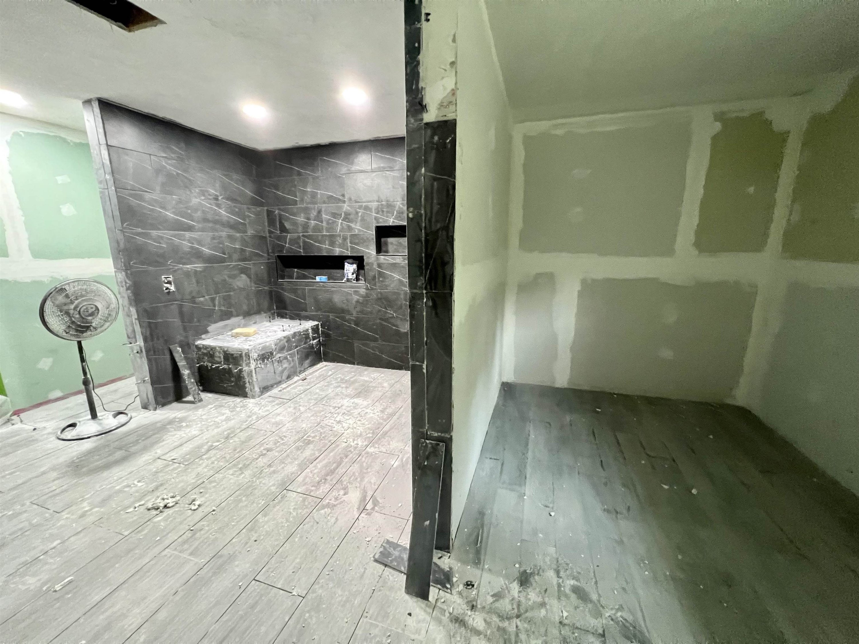 6100 Enville Road Henderson, TN 38340 - Photo 8 of 25 a bathroom with a sink and a glass door shower